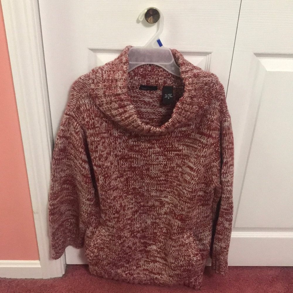 This is a beautiful thick cowl neck sweater. 2 front pockets.